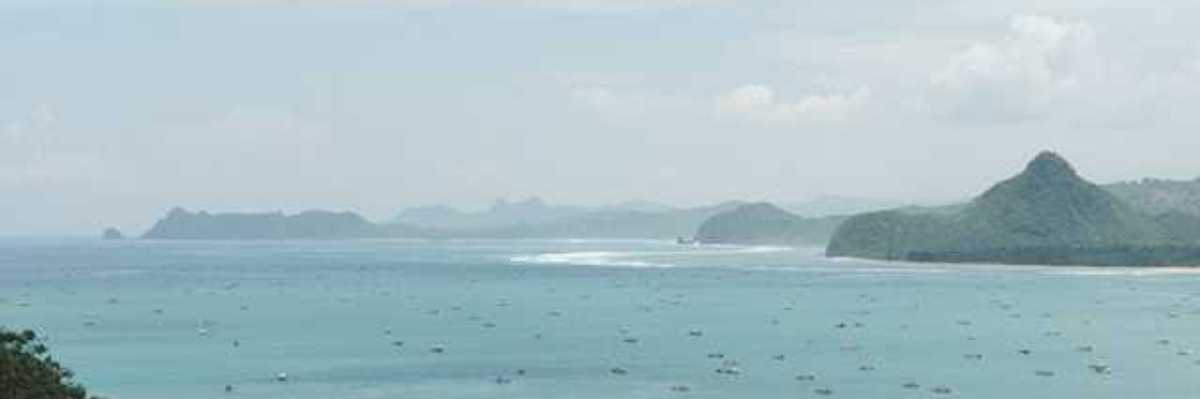 A view of turquoise water and a tropical island