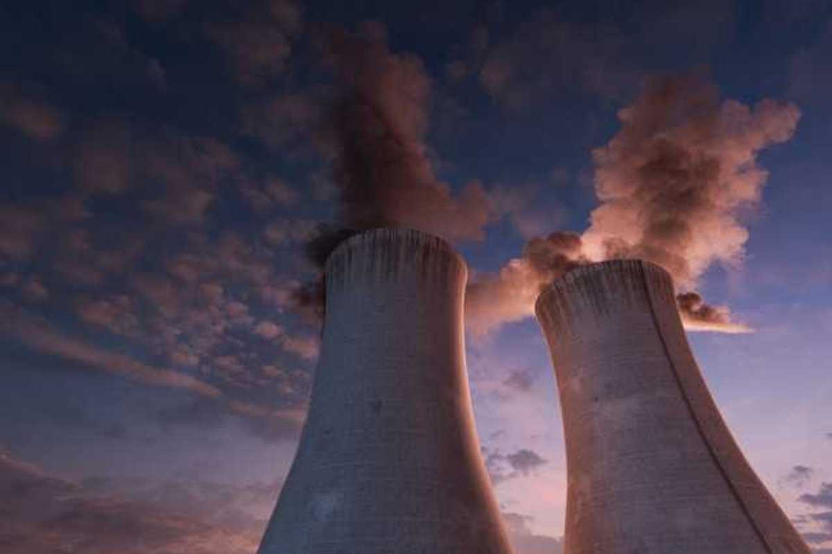 A view of two nuclear towers at sunset