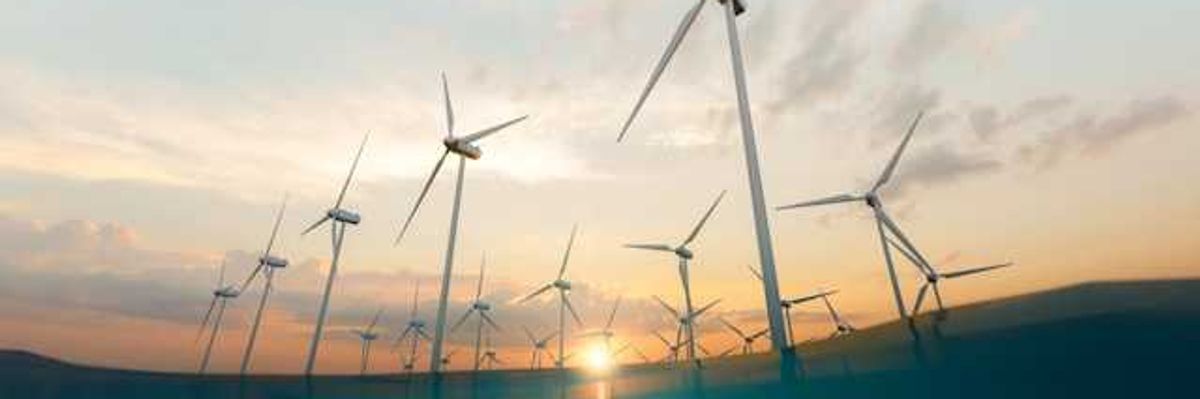 A view of wind turbines as if from beneath the water