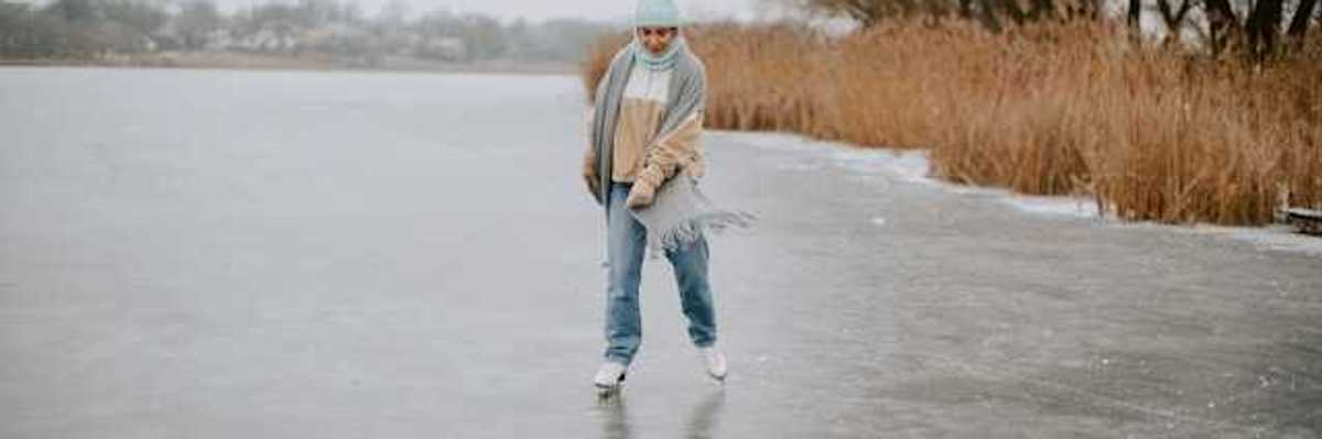 A woman ice skating on a lake