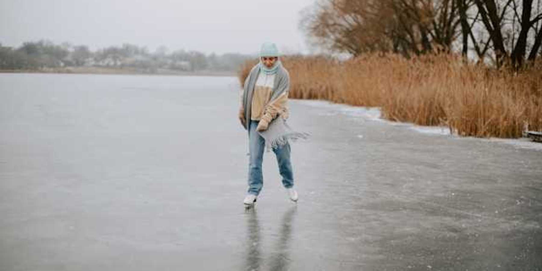 A woman ice skating on a lake
