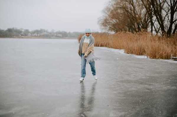 A woman ice skating on a lake