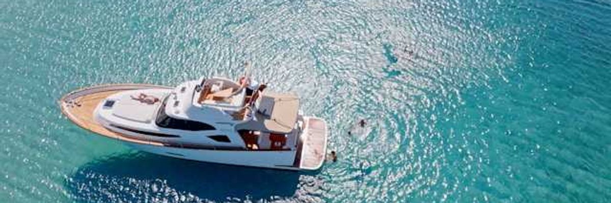 A yacht anchored in aqua blue water