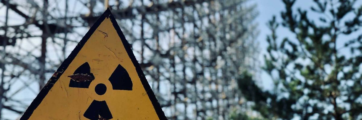 A yellow and black radiation warning sign