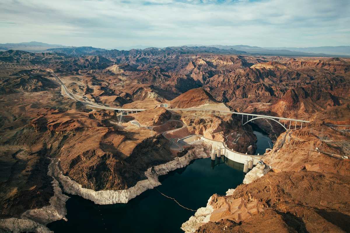 Aerial photo of Lake Mead and Hoover Dam showing low water level evidenced by a "bathtub ring."