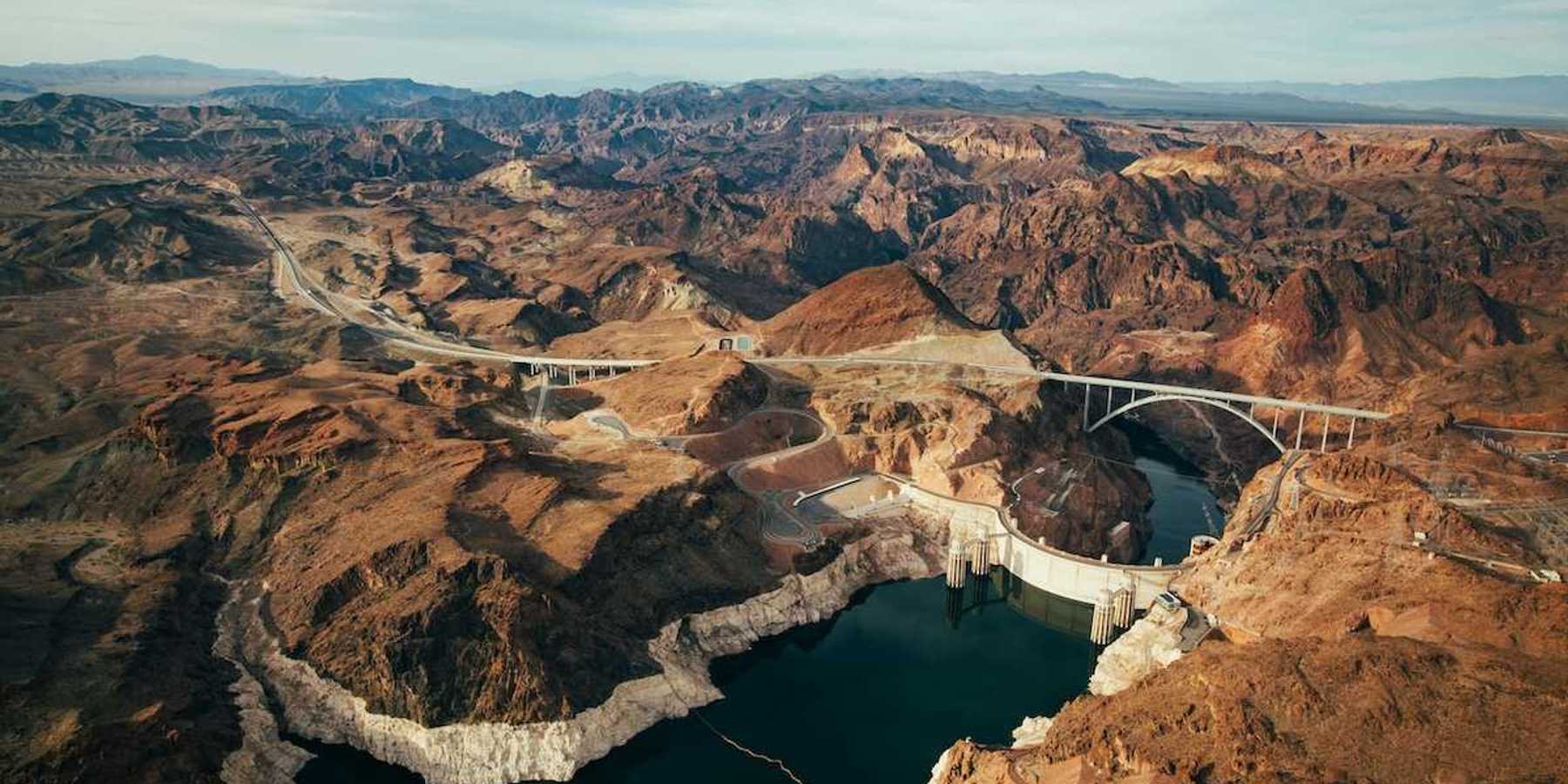 Aerial photo of Lake Mead and Hoover Dam showing low water level evidenced by a "bathtub ring."
