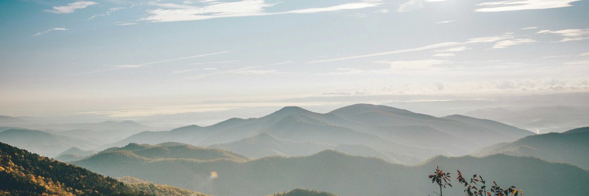 aerial photography of mountain under blue and white sky