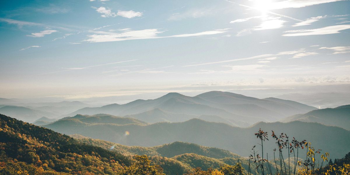aerial photography of mountain under blue and white sky