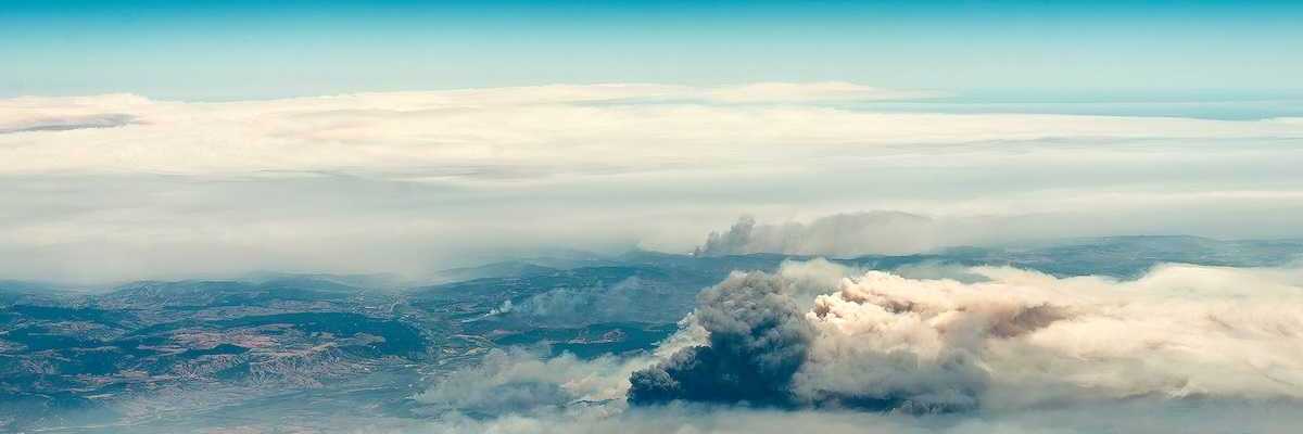 Aerial view of a big column of smoke from forest fire in southern Chile