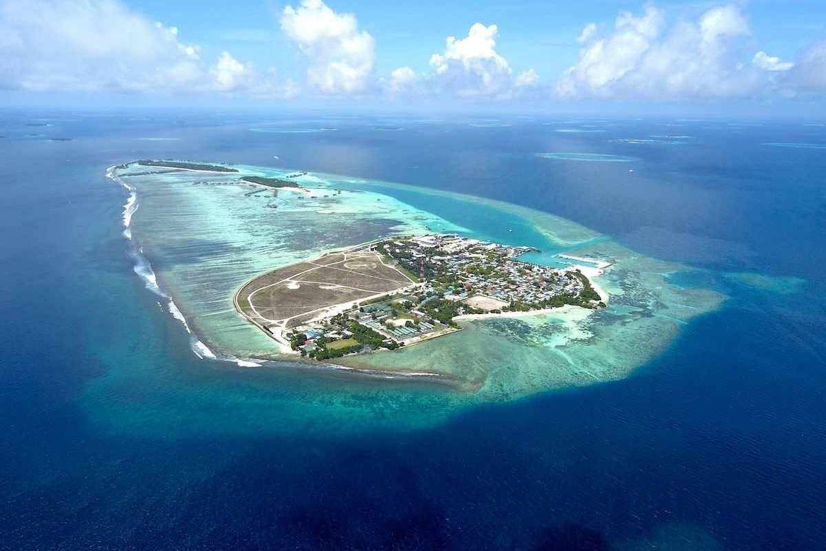 Aerial view of Himmafushi island in the Maldives exemplifying sea level vulnerability