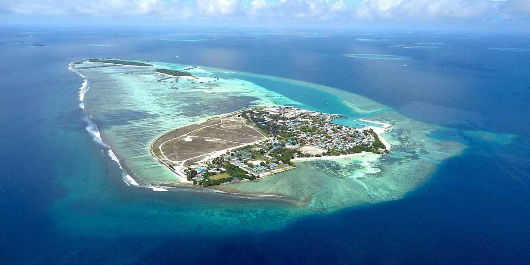 Aerial view of Himmafushi island in the Maldives exemplifying sea level vulnerability