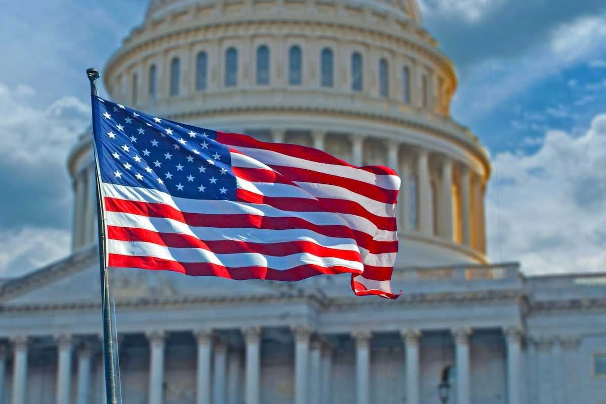 American flag superimposed against the U.S. capitol building.