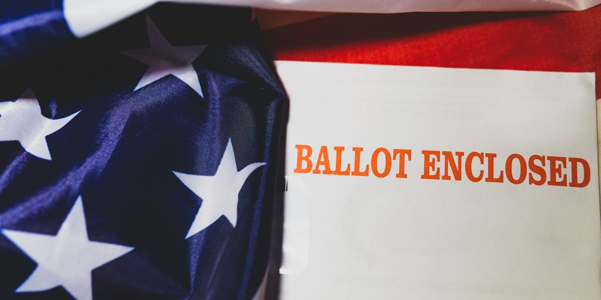 American flag with ballot envelope