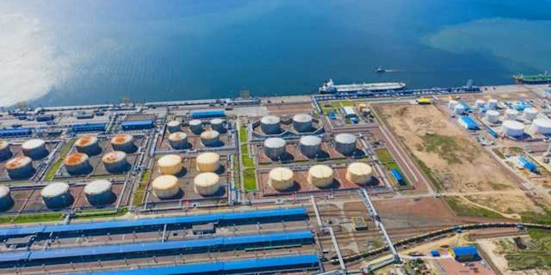 An aerial view of a desalination plant on the edge of a water source