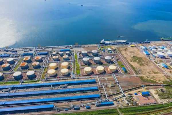 An aerial view of a desalination plant on the edge of a water source