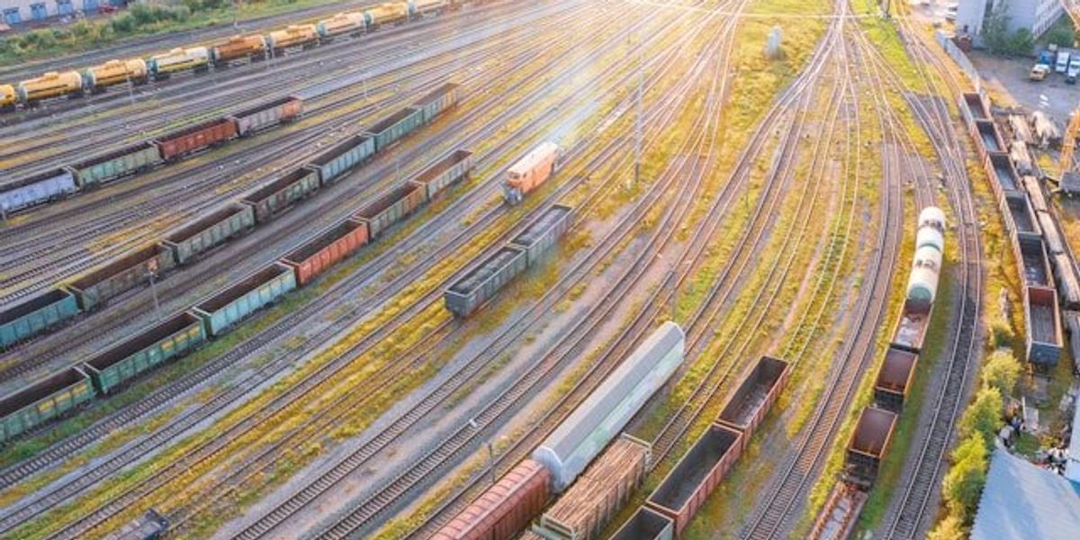 An aerial view of a rail yard with tracks and trains