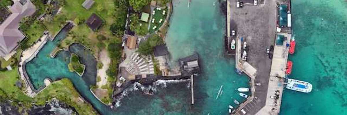 An aerial view of a residential area in Hawaii with inlets and a marina