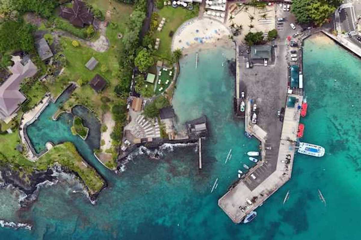 An aerial view of a residential area in Hawaii with inlets and a marina