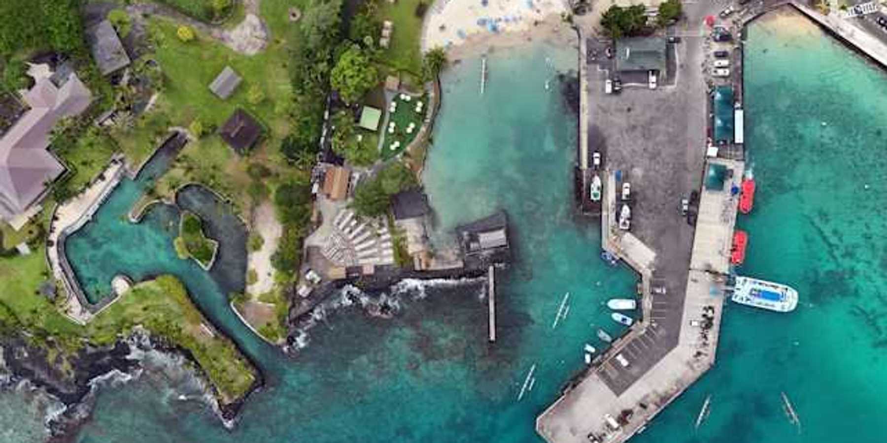 An aerial view of a residential area in Hawaii with inlets and a marina