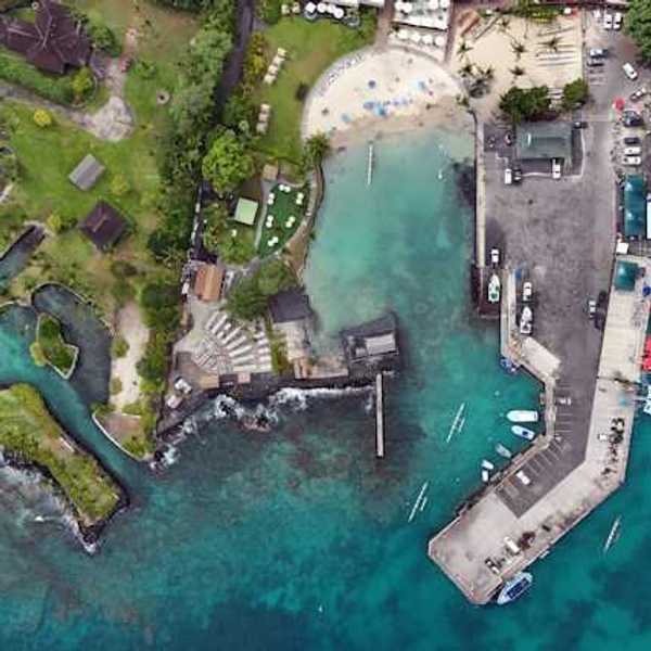 An aerial view of a residential area in Hawaii with inlets and a marina