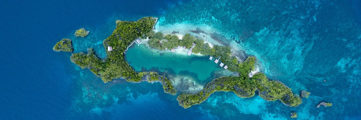 an aerial view of an island in the middle of the ocean