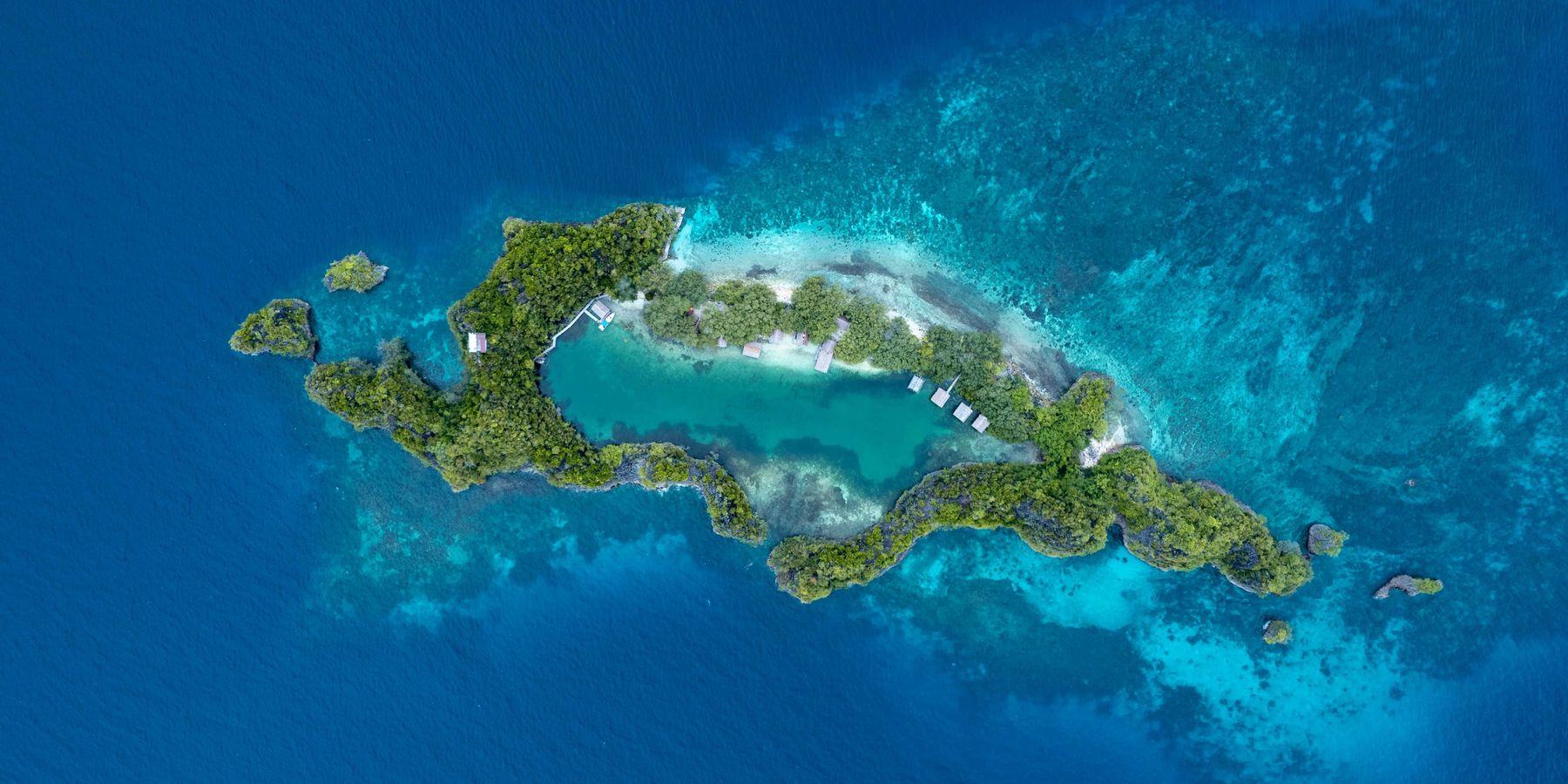 an aerial view of an island in the middle of the ocean