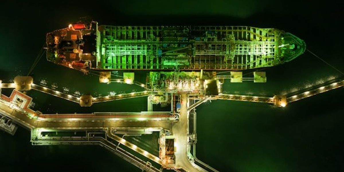 An aerial view of an oil ship at night.