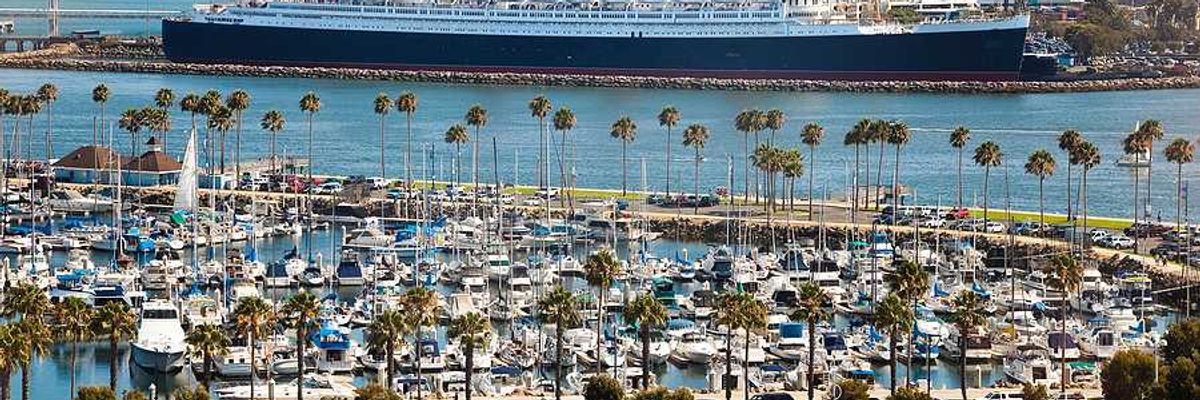 An aerial view of the long beach port with a cruise ship in the background