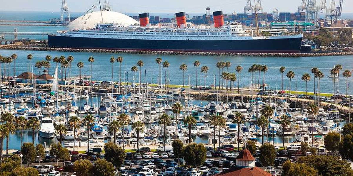 An aerial view of the long beach port with a cruise ship in the background