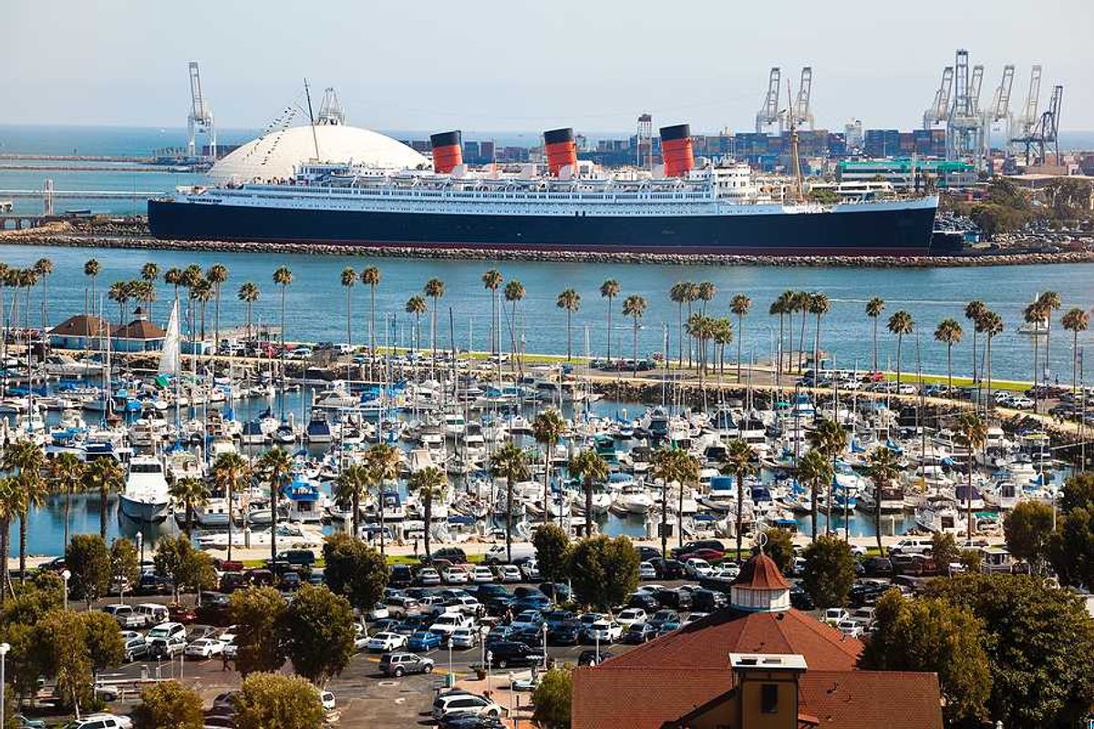 An aerial view of the long beach port with a cruise ship in the background