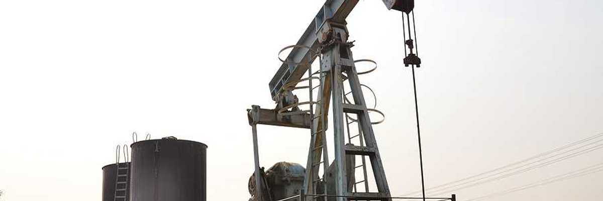 An aging oil pump jack in a desolate location