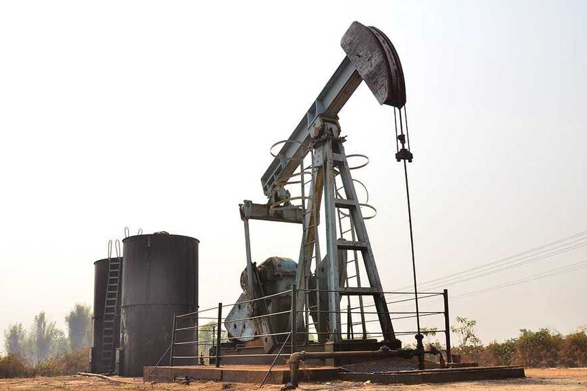 An aging oil pump jack in a desolate location