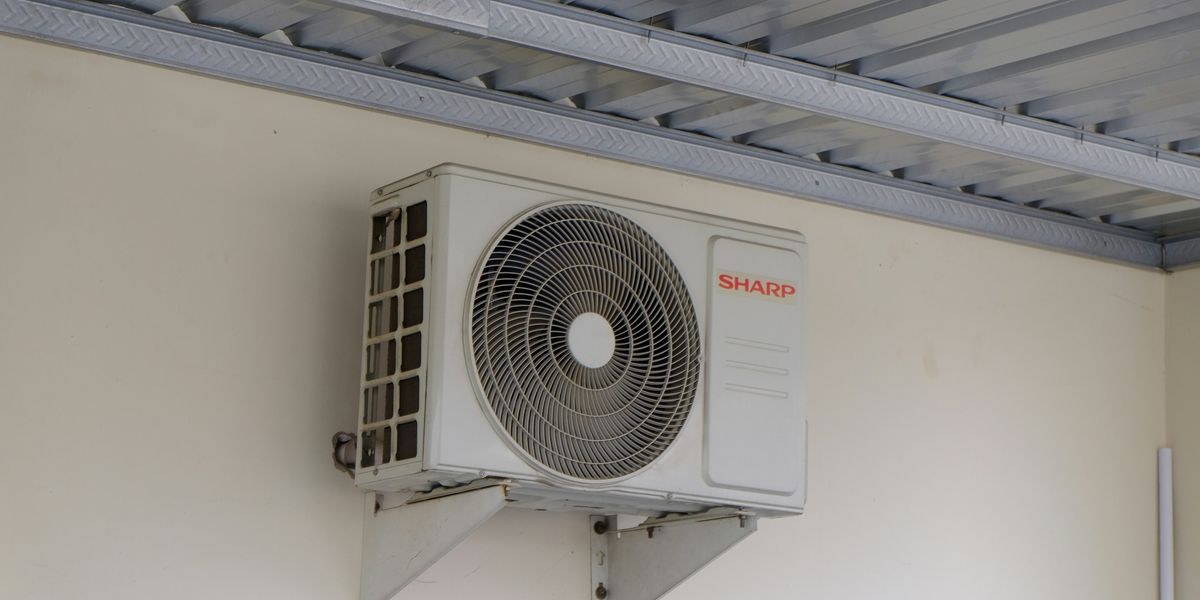 An air conditioning unit mounted on a wall.