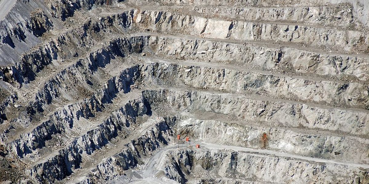 An asbestos mine with tiers or levels cut into the side of a mountain.