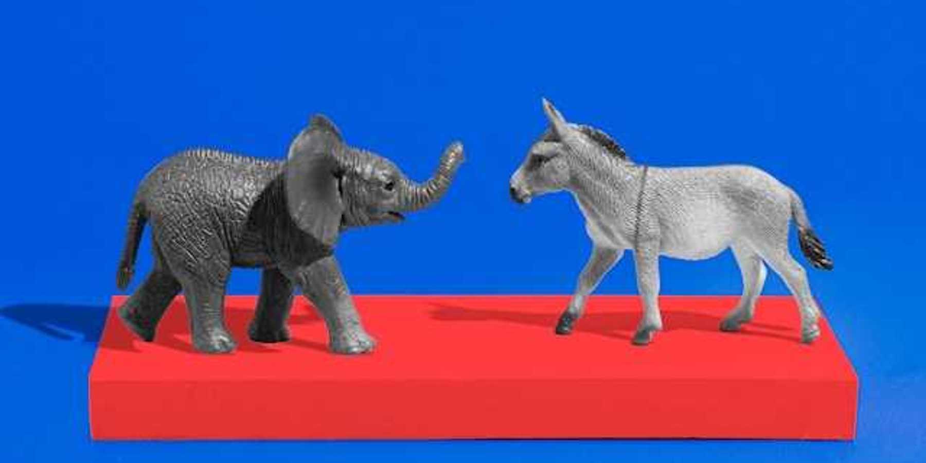 An elephant and a donkey figurine on a red platform with a blue background