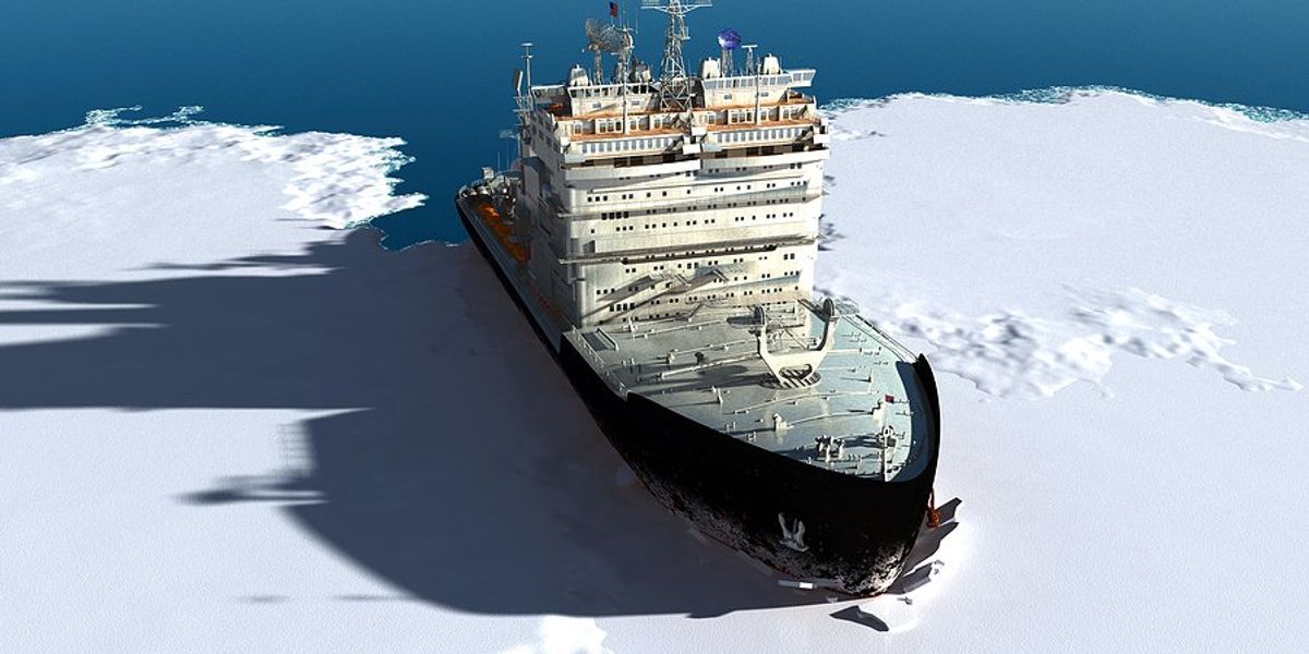 An ice breaker ship making its way through ocean ice.