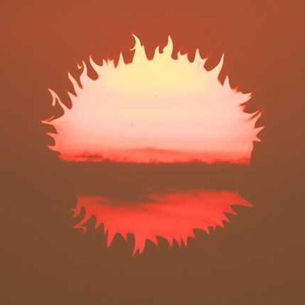 An illustration of a burning sun falling below the horizon