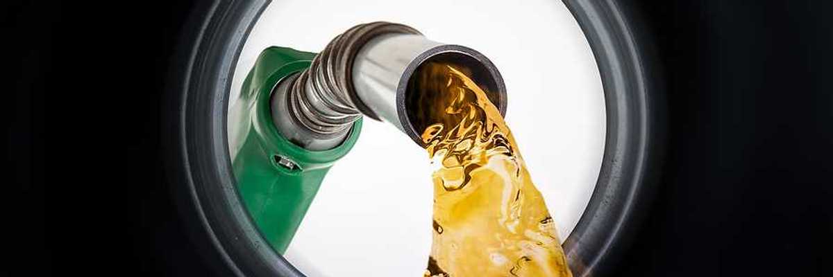 An illustration of a gas pump pouring gas into a gas tank