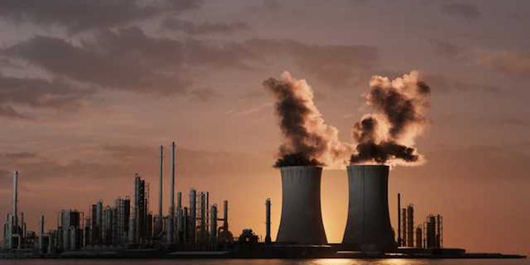 An illustration of a power plant emitting smoke into the air with water in the foreground