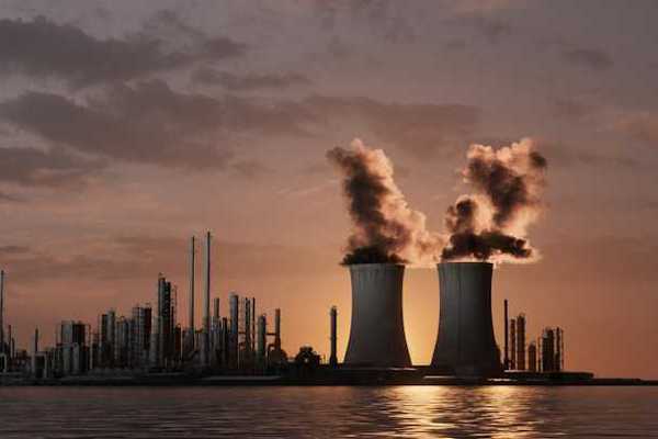 An illustration of a power plant emitting smoke into the air with water in the foreground