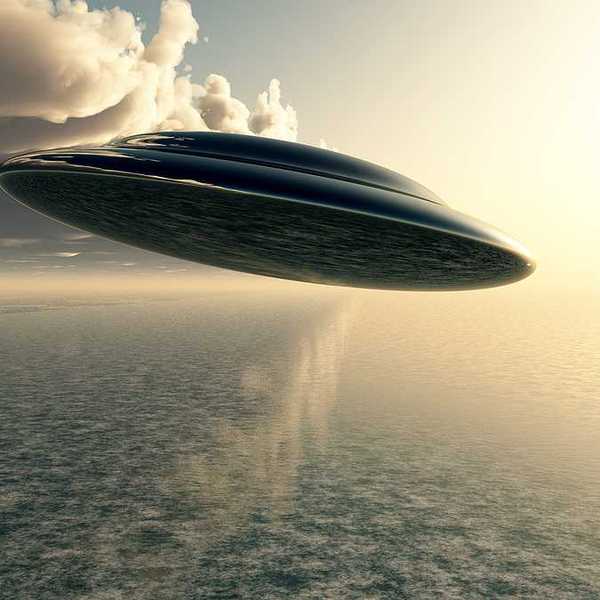 An illustration of a saucer-like space ship flying against a cloudy sky