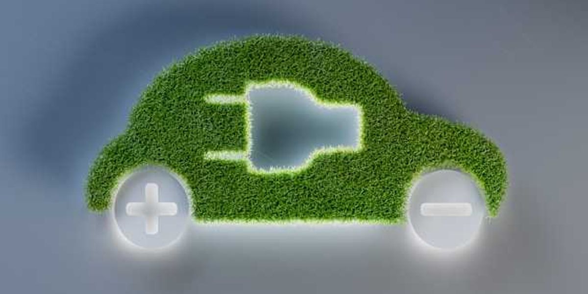 An illustration of an electric vehicle with green grass for the body of the car
