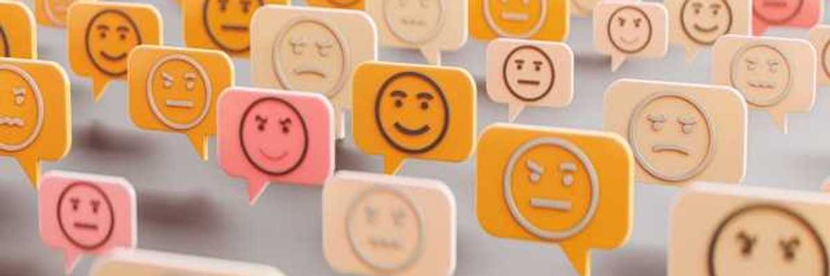 An illustration of comment boxes with happy, sad and angry faces in them