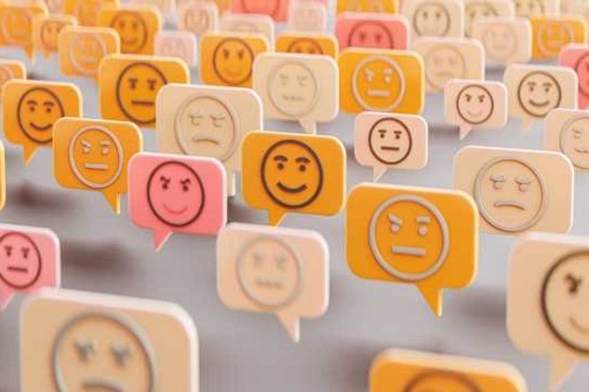 An illustration of comment boxes with happy, sad and angry faces in them