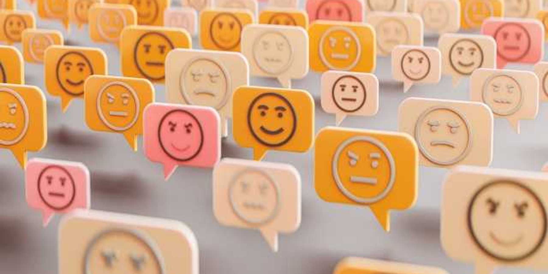 An illustration of comment boxes with happy, sad and angry faces in them