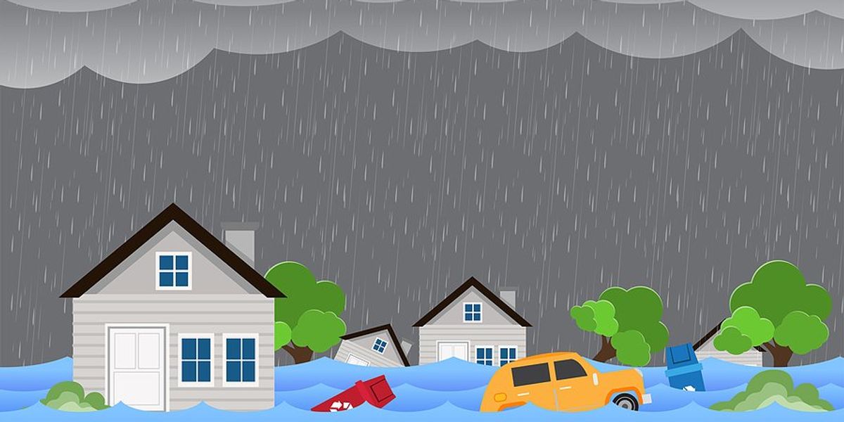 An illustration of houses and cars under flood waters during a rainstorm.
