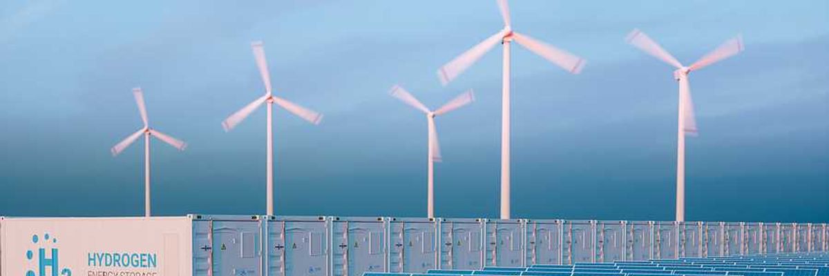 An illustration of storage containers with the word Hydrogen on them, solar panels, and wind turbines