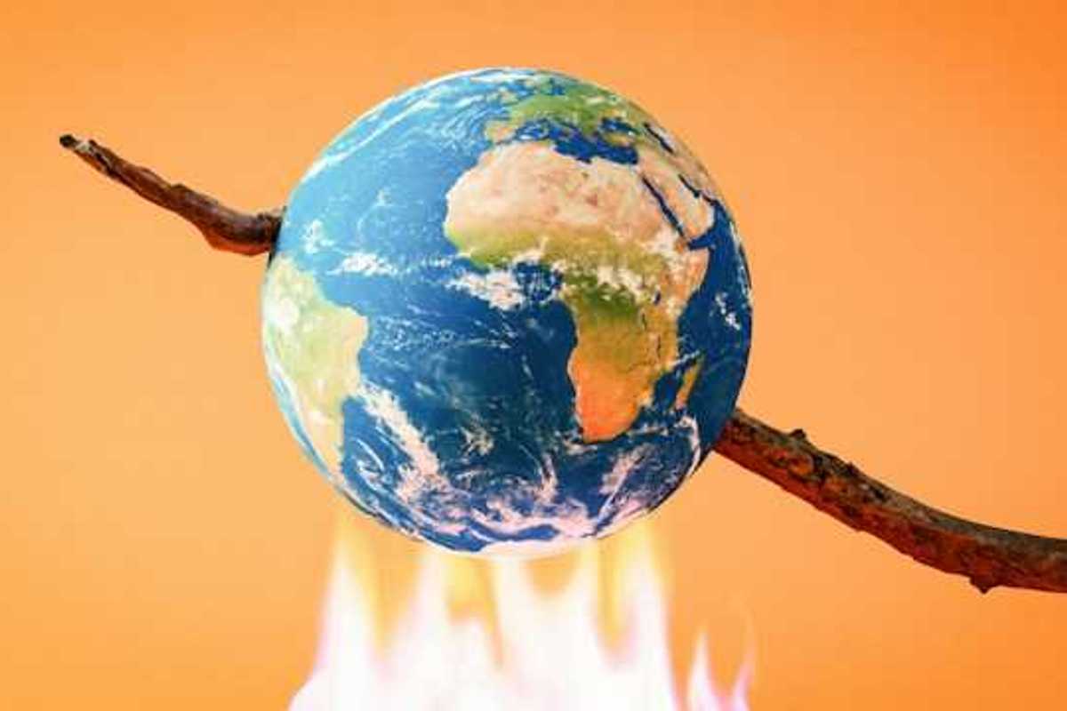 An illustration of the earth on a stick being burned over a fire