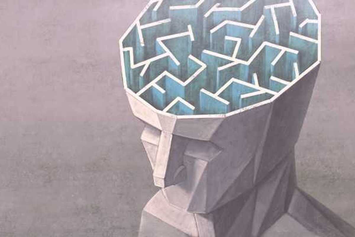An illustration of the top of a human head with the brain exposed showing a maze
