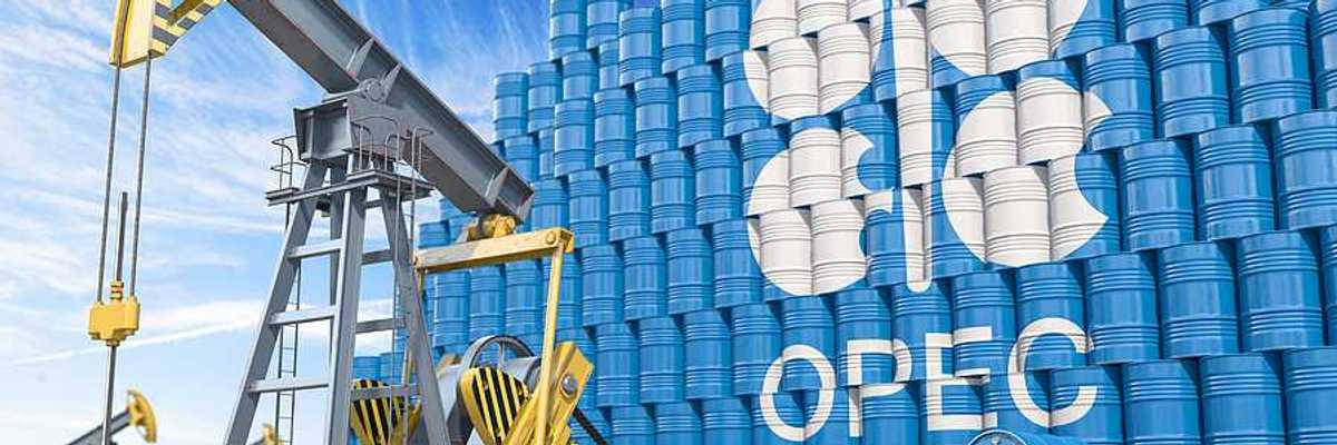 An illustration with a tower of blue oil drums with the word OPEC on it